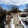 TimesCall > A cyclist rides along the St. Vrain Greenway through Rogers Grove in Longmont on Saturday, March 2, 2013.
(Greg Lindstrom/Times-Call)